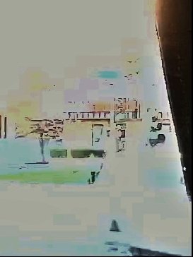Overexposed doorway camera frame — enhanced