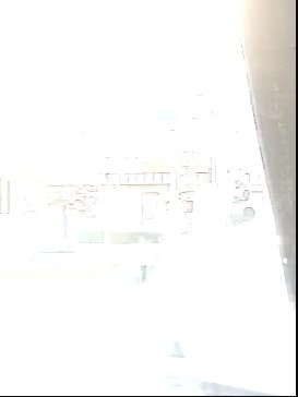 Overexposed doorway camera frame — original