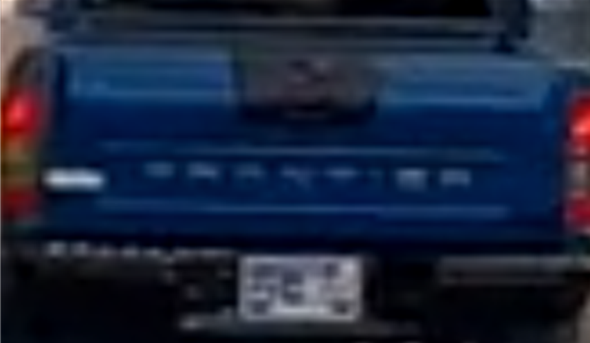 Rear license plate of a pickup truck — original